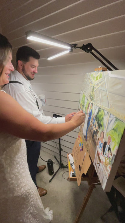 Bride and Groom helping paint their live wedding painting